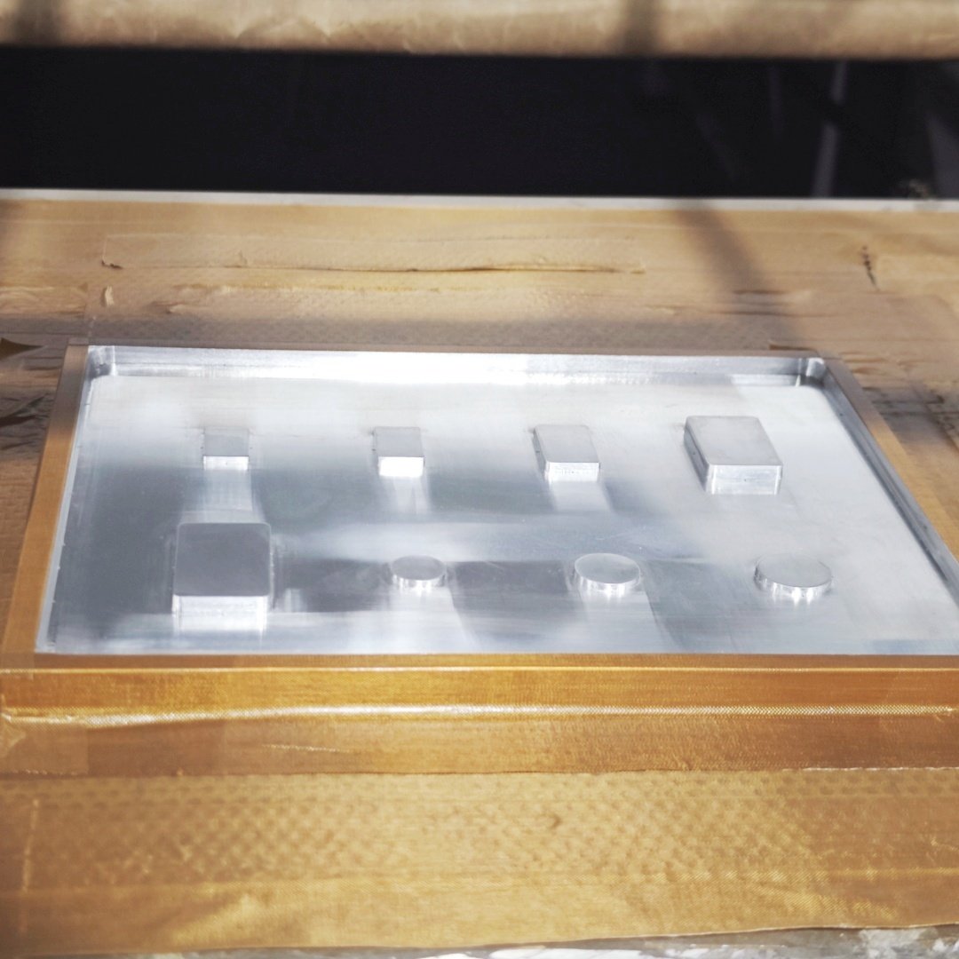 Production of clear blister cavities for custom precious metal coin packaging